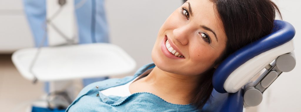 Portrait of female patient in dental office.